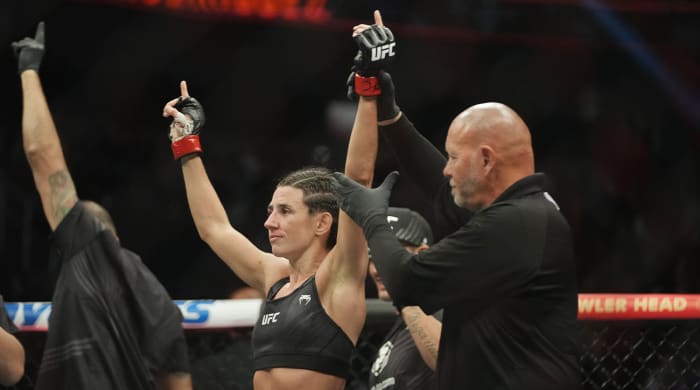 Mar 5, 2022; Las Vegas, Nevada, UNITED STATES; Marina Rodriguez (red gloves) celebrates after defeating Yan Xiaonan (not pictured) during UFC 272 at T-Mobile Arena.